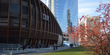 Contemporary architecture in Milan with skyscrapers and natural elements.