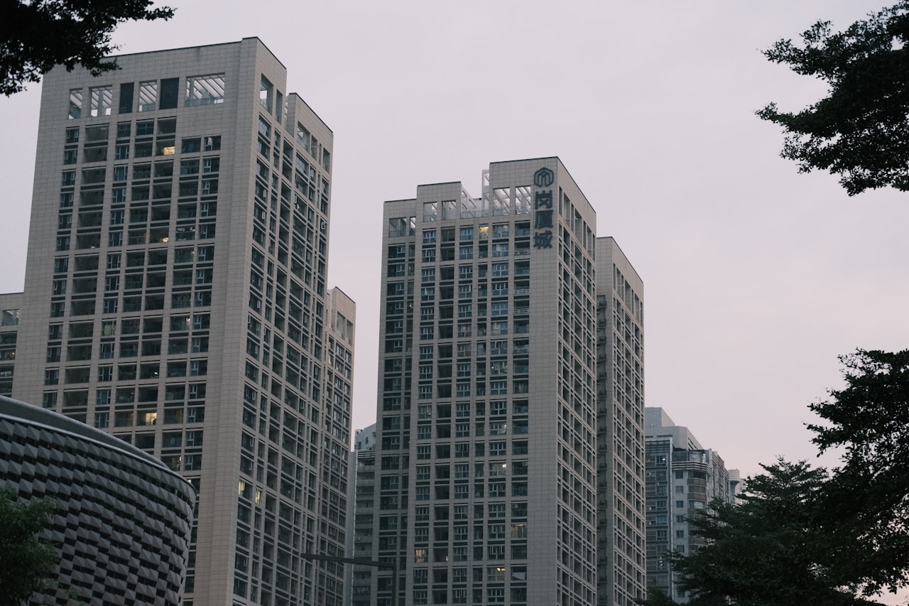 a couple of tall buildings sitting next to each other