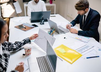 business people working laptops modern office