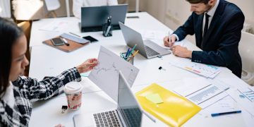 business people working laptops modern office