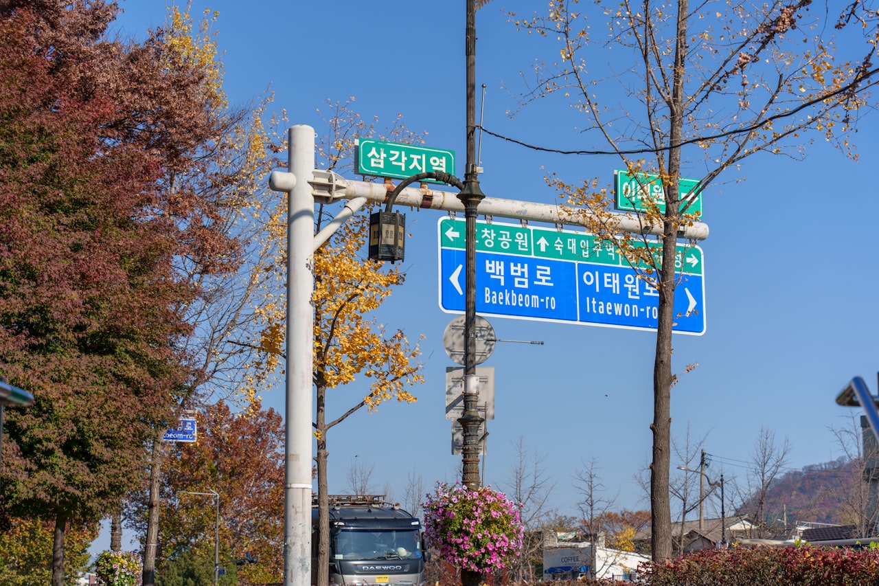 Road signs point the way in a city.