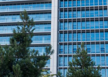 corporate sustainability office green building glass facade