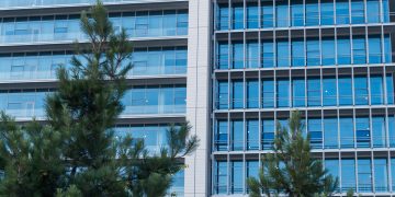 corporate sustainability office green building glass facade
