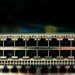 Detailed view of a network switch featuring multiple ethernet ports and LED indicators.