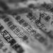 Artistic close-up of Chinese text on crumpled paper with selective focus and blur.