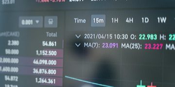 Close-up of a cryptocurrency trading screen displaying real-time data, graphs, and analytics.