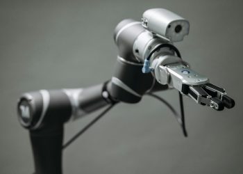 Close-up view of a robotic arm equipped with a video camera, showcasing modern technology.
