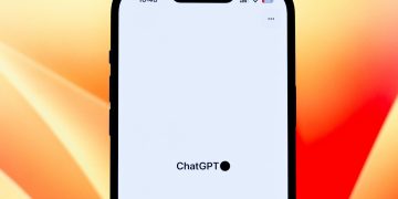 Close-up view of a smartphone showcasing the ChatGPT app against a colorful background.
