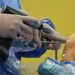 Orthopedic surgeon using equipment during knee arthroscopy in the operating room.