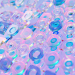Vibrant abstract 3D render featuring transparent glass shapes with a holographic effect.