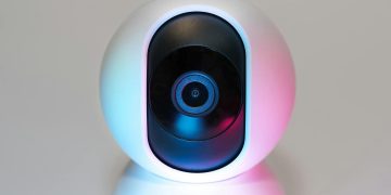 Futuristic IP security camera in soft lighting, perfect for modern smart home setups.