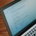 A close-up view of a laptop displaying a search engine page.