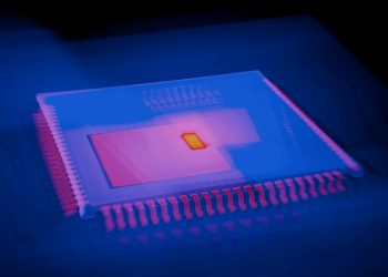 Blurred abstract image of a microchip with heatmap colors highlighting technolog
