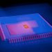 Blurred abstract image of a microchip with heatmap colors highlighting technolog