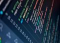 Close-up of a computer screen displaying colorful programming code with depth of field.