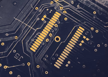 Detailed view of a modern electronic circuit board showing intricate pathways and components.
