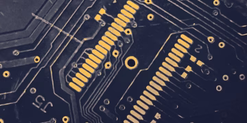 Detailed view of a modern electronic circuit board showing intricate pathways and components.
