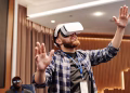 Adult man exploring virtual reality indoors. Immersive tech moment captured.