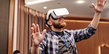 Adult man exploring virtual reality indoors. Immersive tech moment captured.