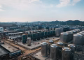 Expansive aerial view of an industrial complex with storage tanks, located in China.