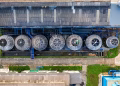 Drone view of industrial terrain with treatment plants located in suburban area in sunlight