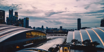Scenic Singapore city skyline at dusk featuring modern skyscrapers and urban architecture.