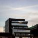 Contemporary architecture showcasing Amazon office at dusk in Iași, Romania.