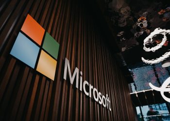Interior view of Microsoft office with logo on wooden wall in Brussels, Belgium.