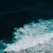 Stunning high-angle view of ocean waves crashing, showcasing nature's powerful beauty.