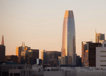 San Francisco skyline featuring modern skyscrapers at sunset, highlighting Salesforce Tower.