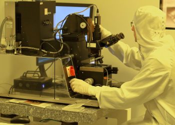 person using black industrial machine