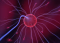 Close-up of a glowing plasma ball with colorful electric currents reaching outwards.