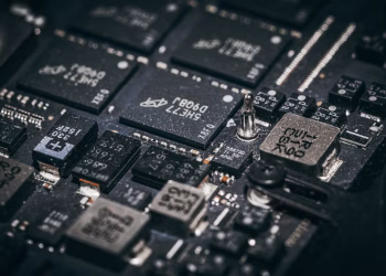 Detailed close-up of electronic microchips on a circuit board, showcasing technology and engineering intricacies.