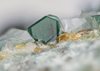 Detailed shot of translucent gemstone crystals with vibrant colors and intricate texture.
