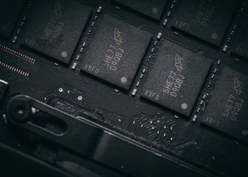 Detailed shot of microchips on a circuit board, showcasing electronic technology and precision engineering.