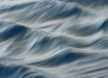 Blurred motion of ocean waves at Guaratuba Beach creates a soothing abstract effect.