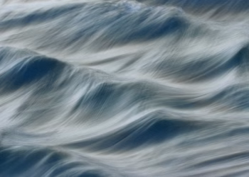 Blurred motion of ocean waves at Guaratuba Beach creates a soothing abstract effect.