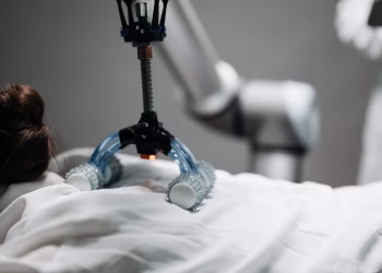 Close-up of a robotic massage arm applying therapy on a person, showcasing innovation.
