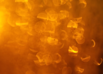 Warm abstract bokeh with vibrant orange and yellow hues, perfect for backgrounds.