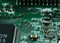 Detailed macro view of a circuit board showcasing microchips and electronic components.