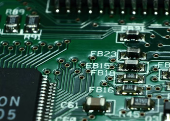 Detailed macro view of a circuit board showcasing microchips and electronic components.