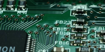 Detailed macro view of a circuit board showcasing microchips and electronic components.