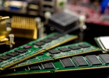 Detailed view of RAM sticks and microprocessors on a motherboard.