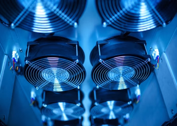 Close-up of cooling fans in a server room, showcasing technology and efficiency.