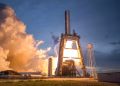 A dramatic shot of a SpaceX rocket launch against a colorful dusk sky, depicting power and technology.
