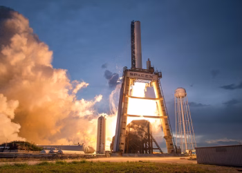 A dramatic shot of a SpaceX rocket launch against a colorful dusk sky, depicting power and technology.