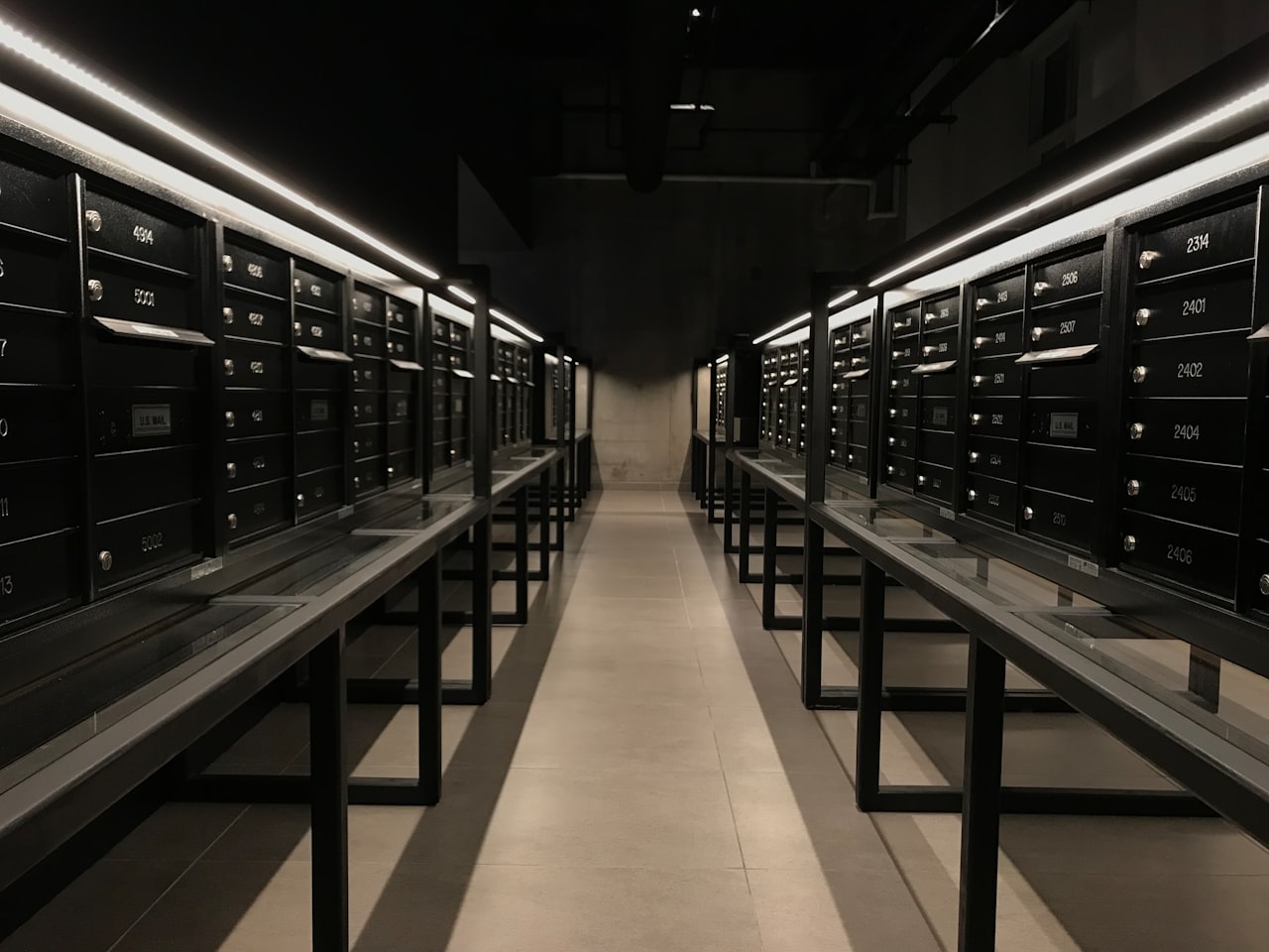 a long row of mail boxes sitting next to each other