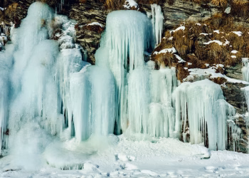 Majestic icicles and frozen waterfall capturing the essence of winter in nature.