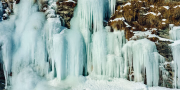Majestic icicles and frozen waterfall capturing the essence of winter in nature.