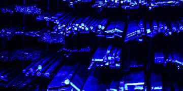 Rows of metal bars illuminated with blue light